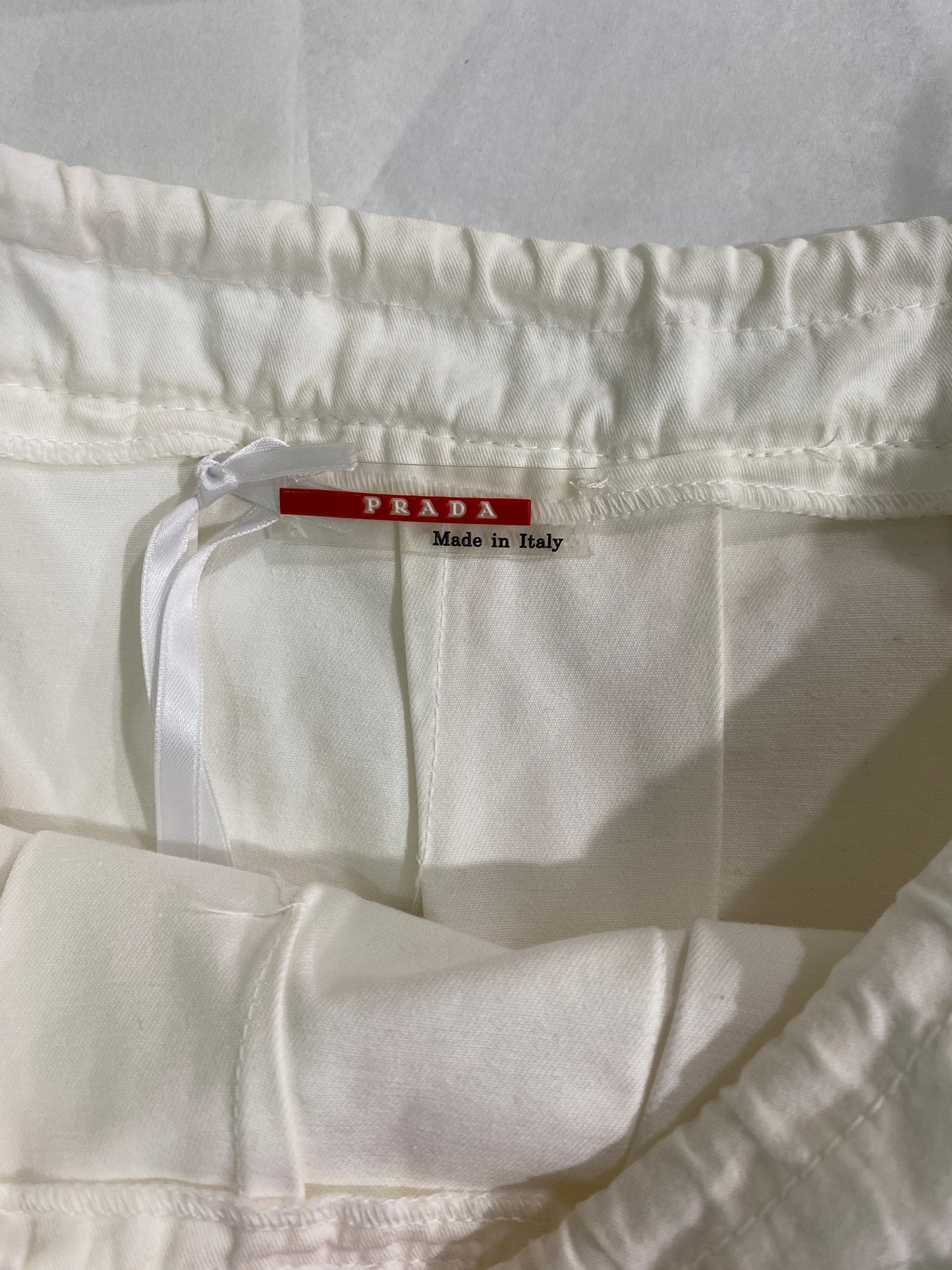 Treasure, Prada white skirt