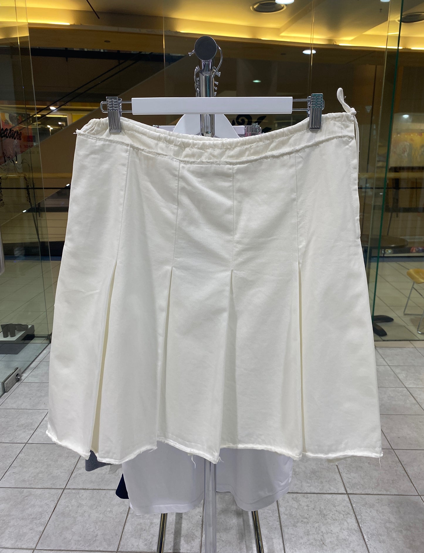 Treasure, Prada white skirt