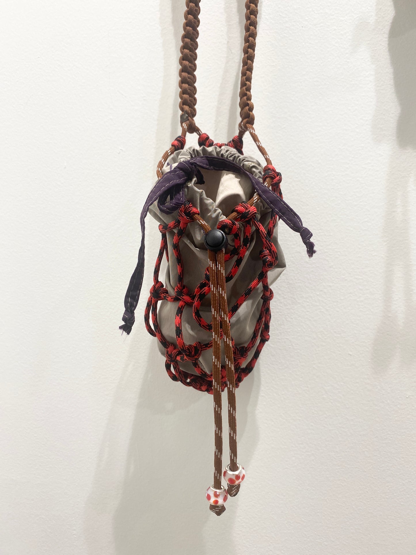 Amihan Aquilizan, bottle bag red/black/brown