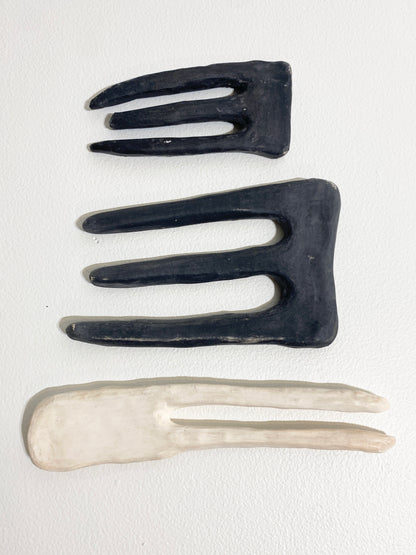 Three prong (dark), 2026