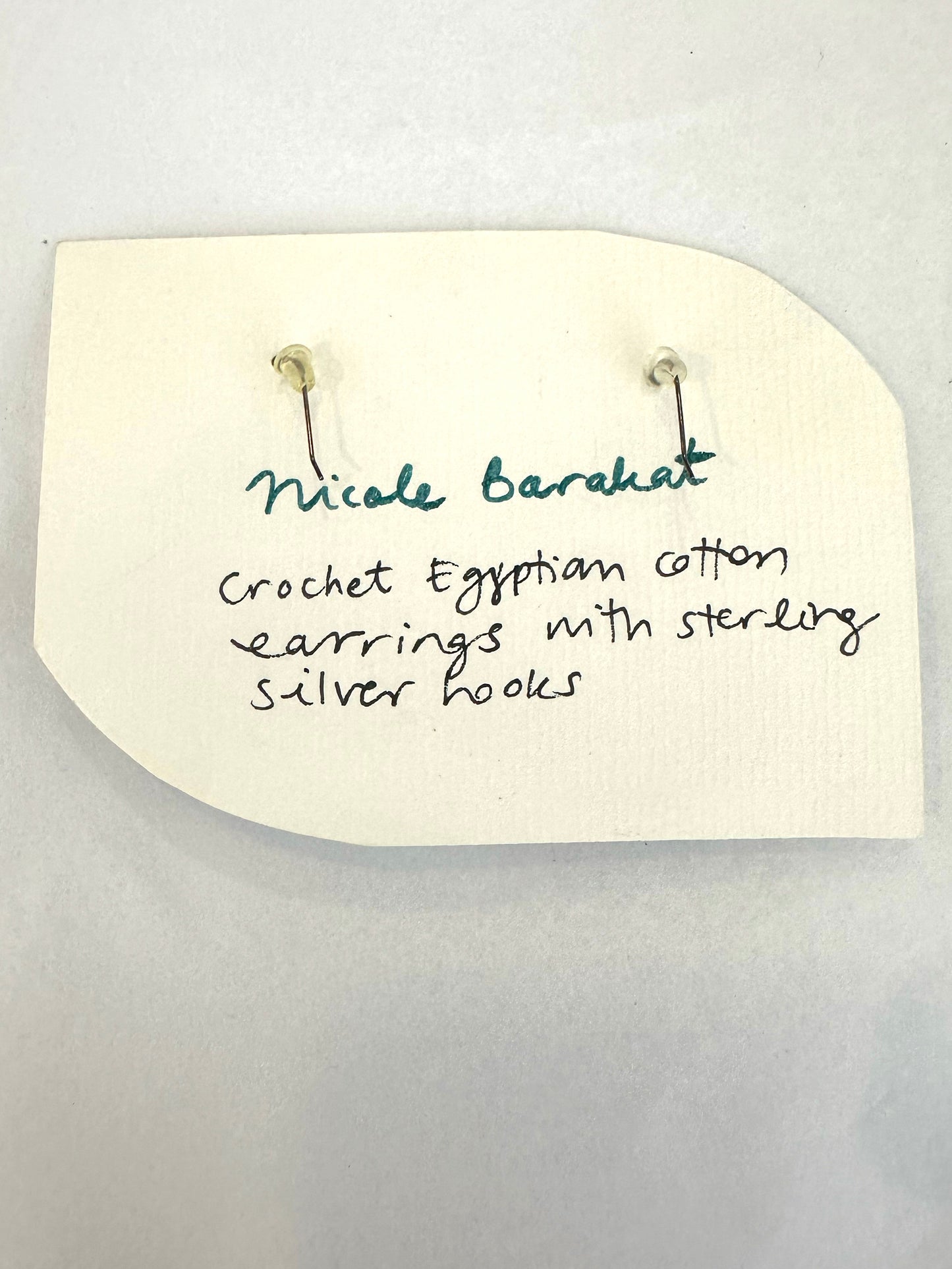 Nicole Barakat, crochet black and gold earrings