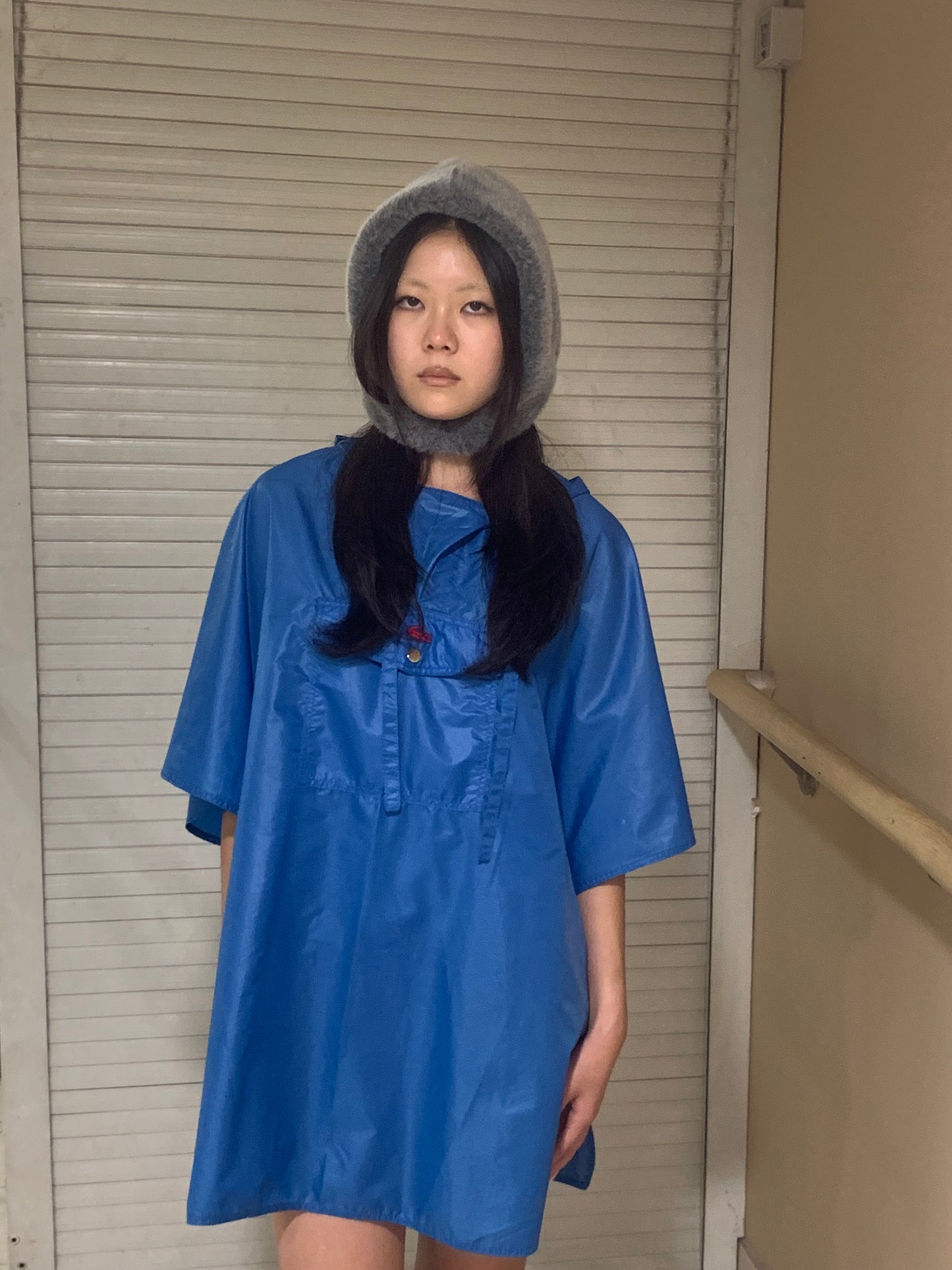 Mindy, Lacoste blue rain poncho