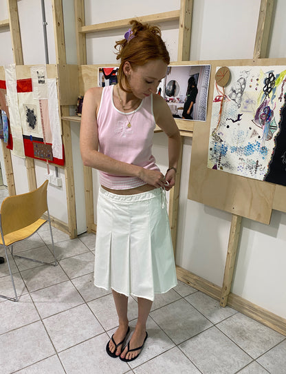 Treasure, Prada white skirt