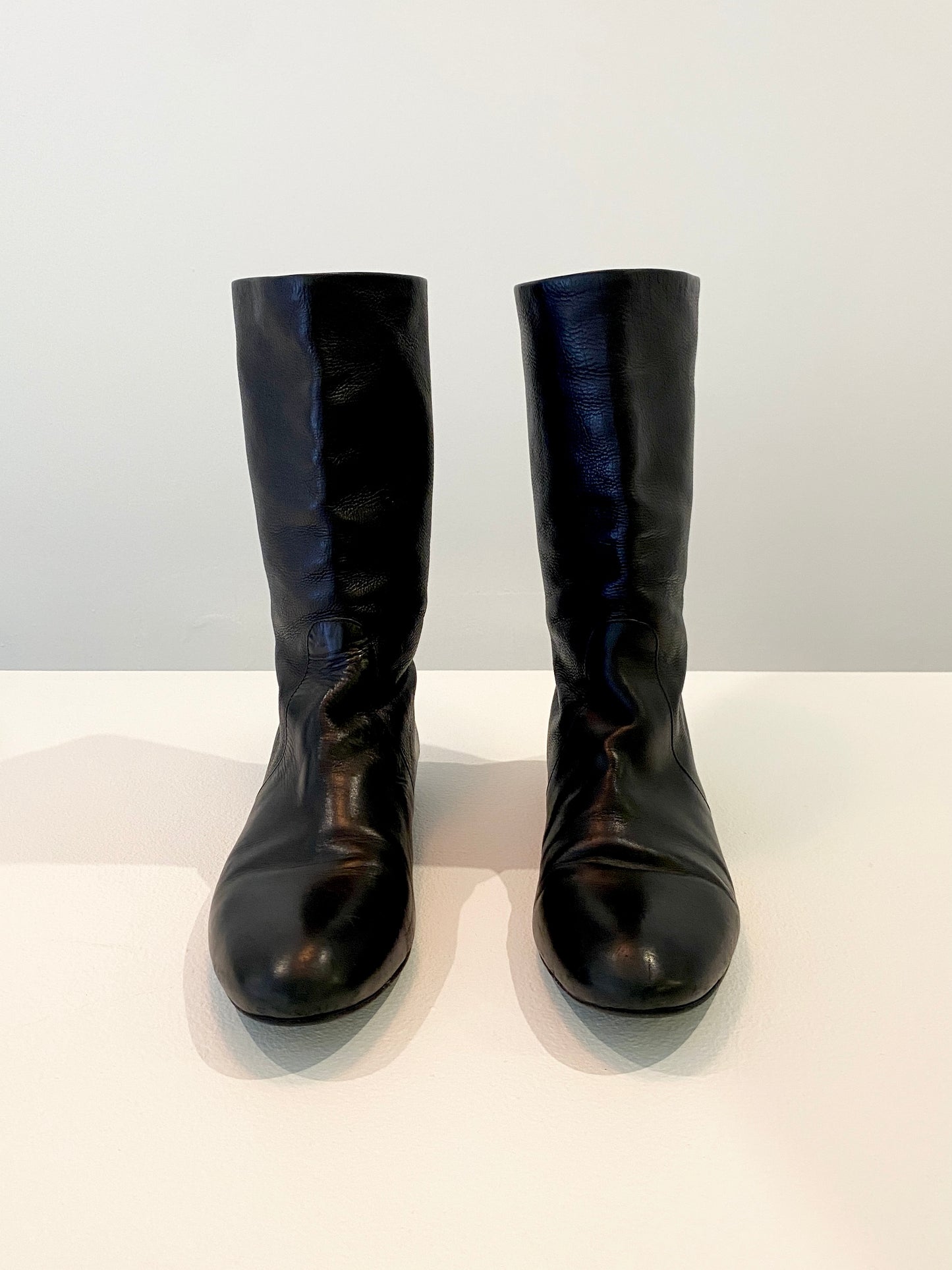 Treasure, Prada boots