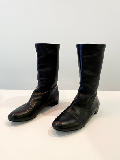 Treasure, Prada boots