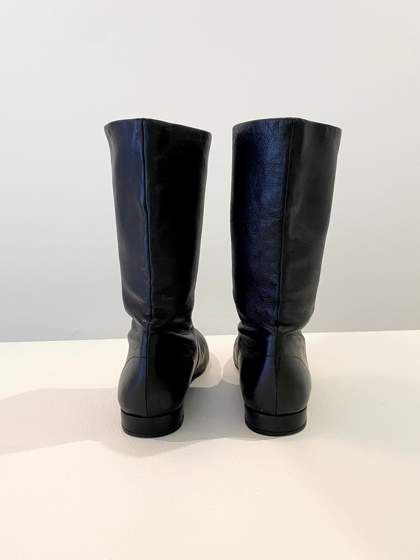 Treasure, Prada boots