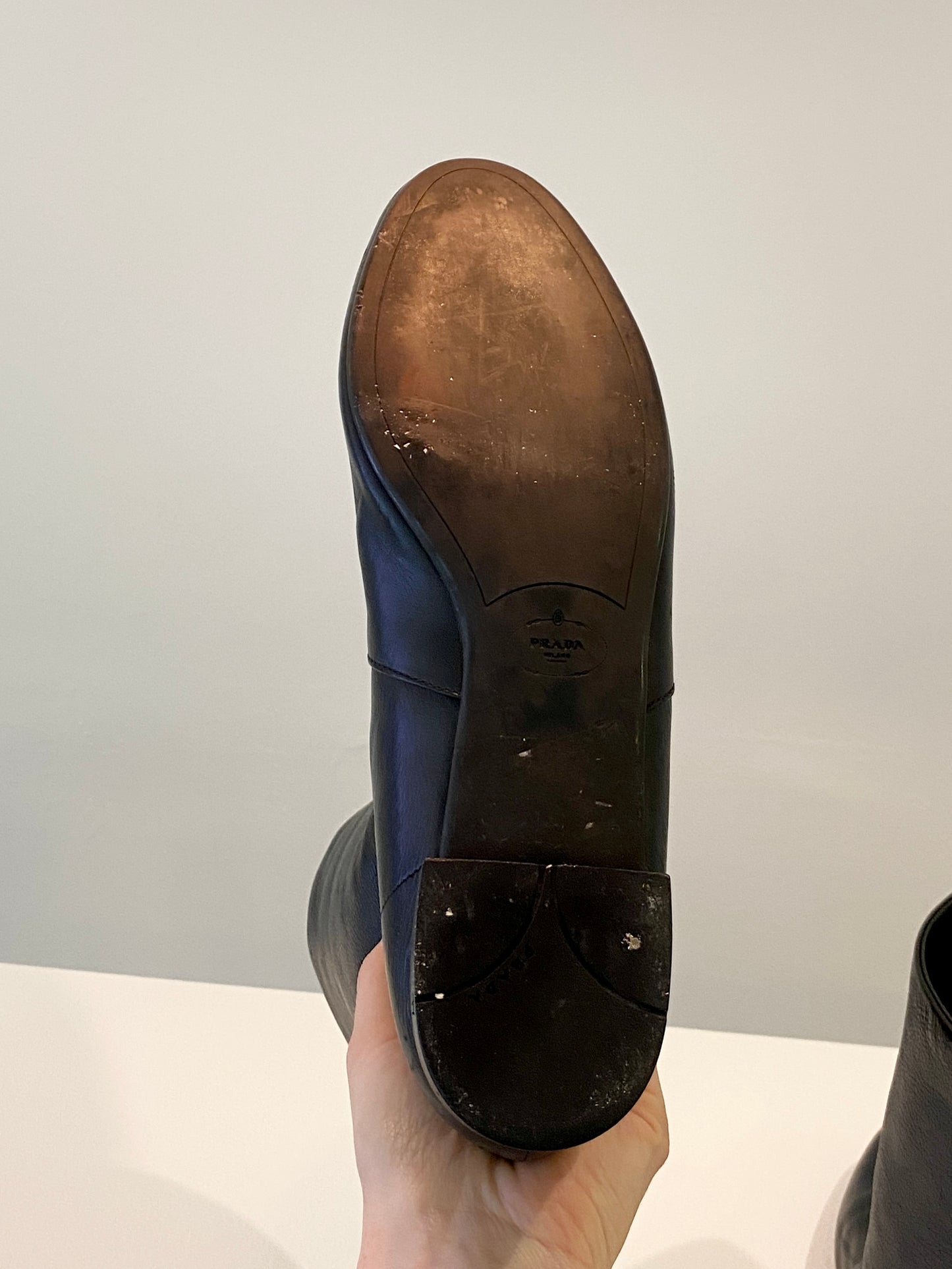 Treasure, Prada boots