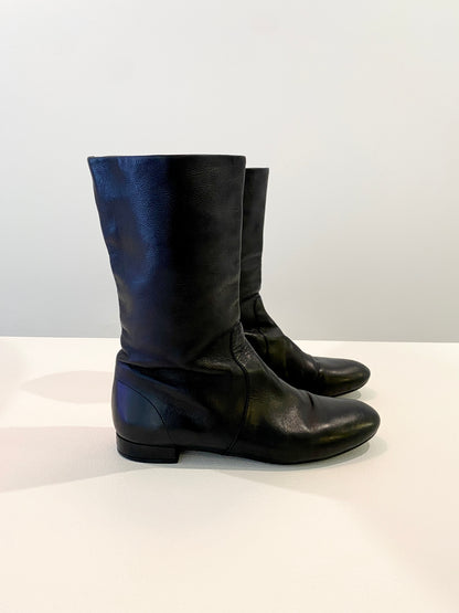 Treasure, Prada boots