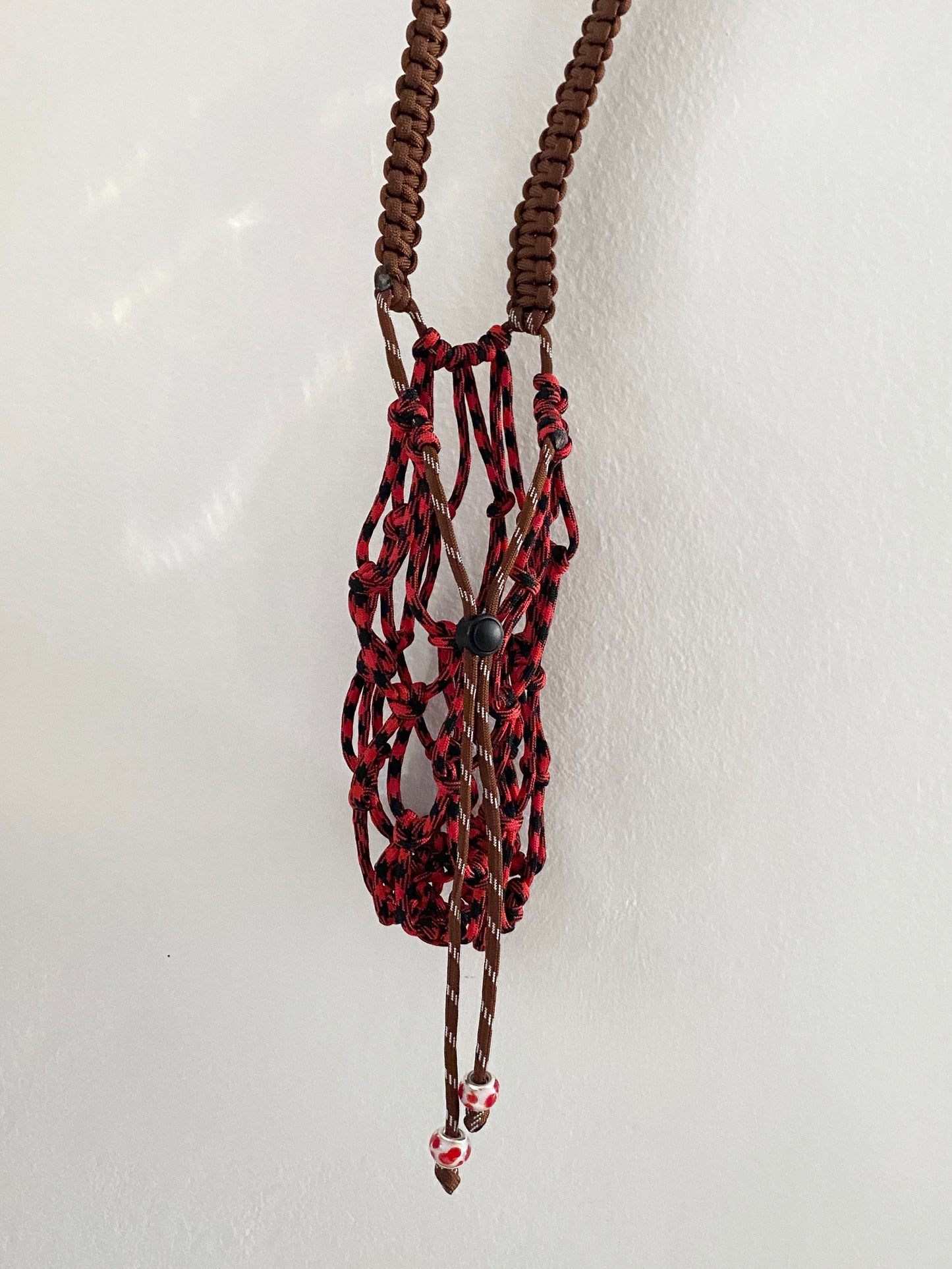 Amihan Aquilizan, bottle bag red/black/brown