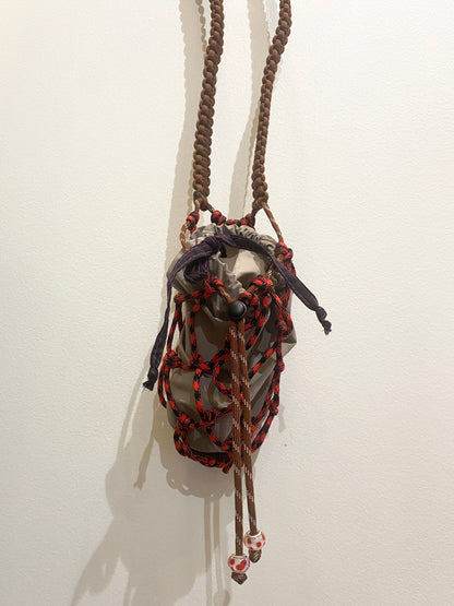 Amihan Aquilizan, bottle bag red/black/brown