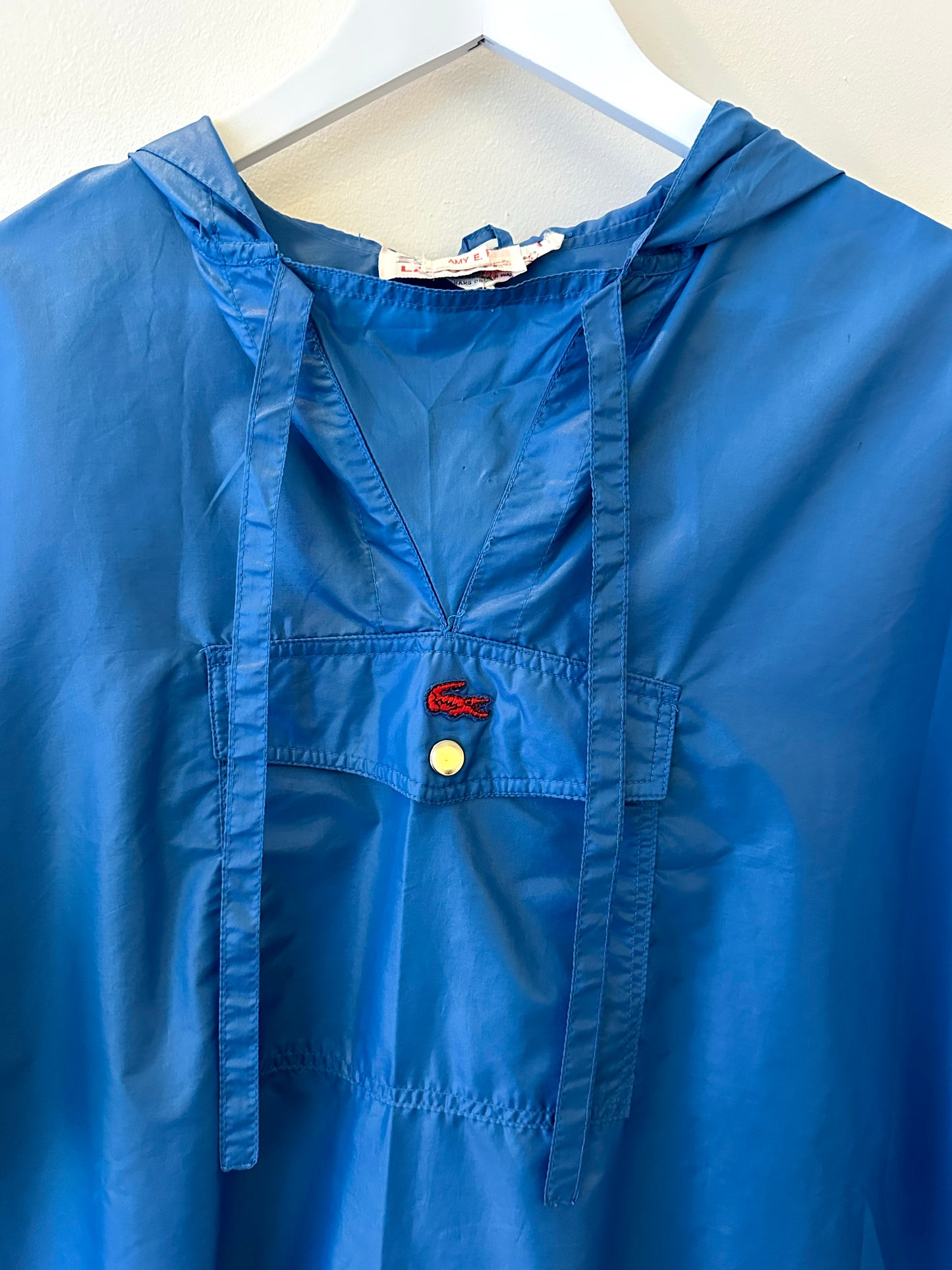 Mindy, Lacoste blue rain poncho