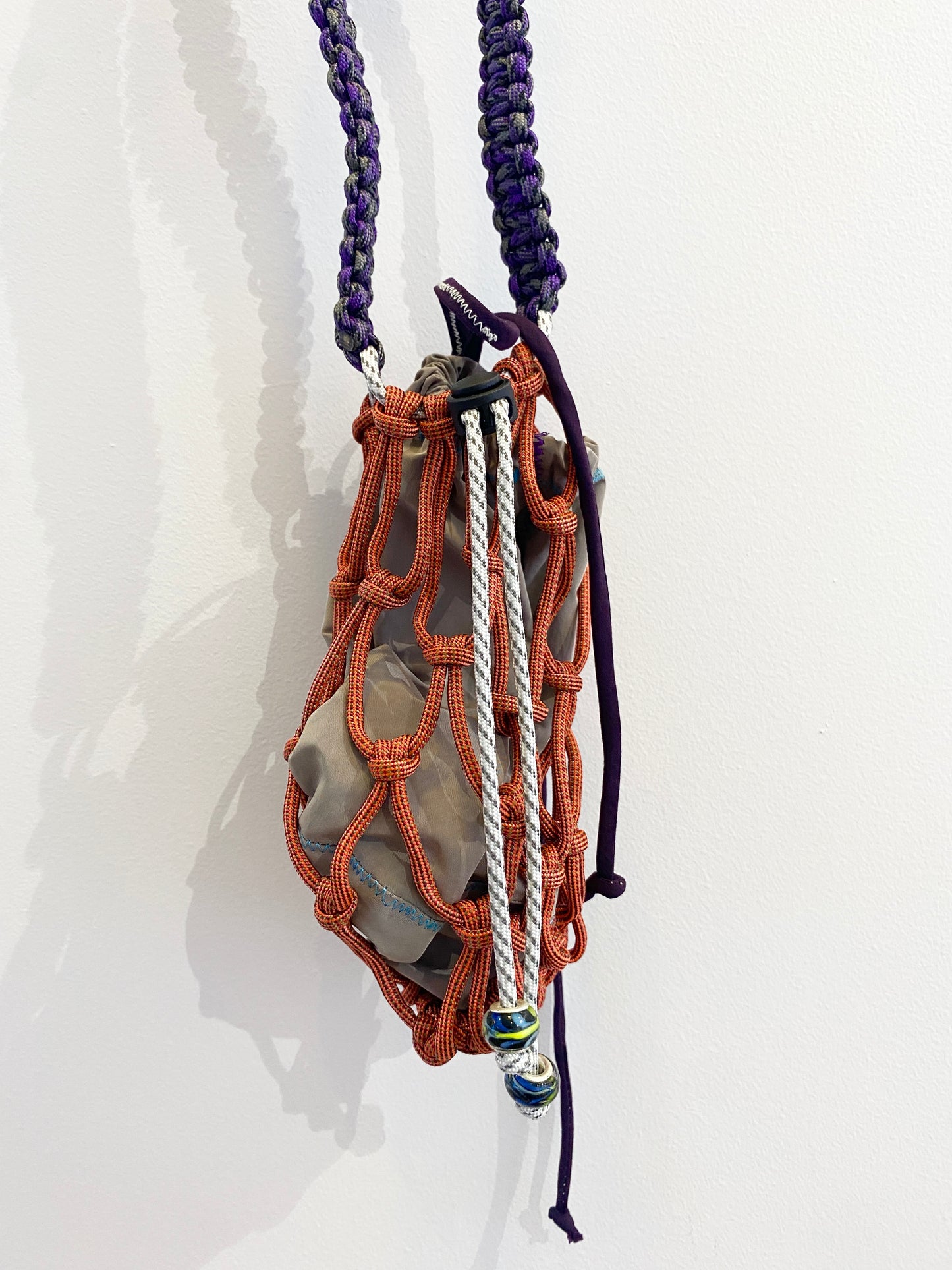Amihan Aquilizan, cross body bottle bag orange/purple/grey