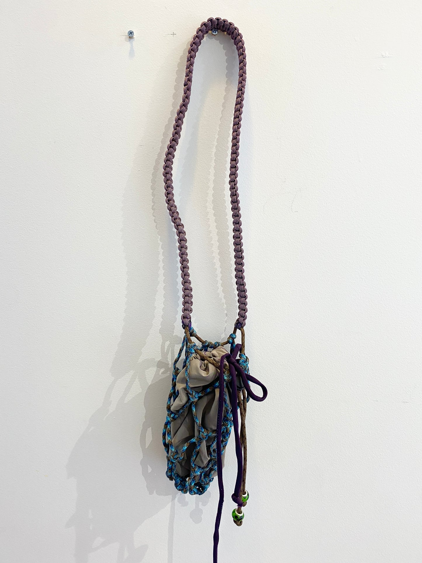 Amihan Aquilizan, over the shoulder bottle bag blue/brown/purple