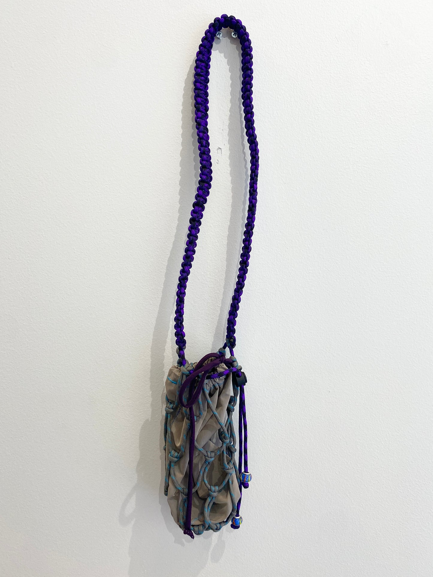 Amihan Aquilizan, over the shoulder bottle bag grey/turquoise/purple