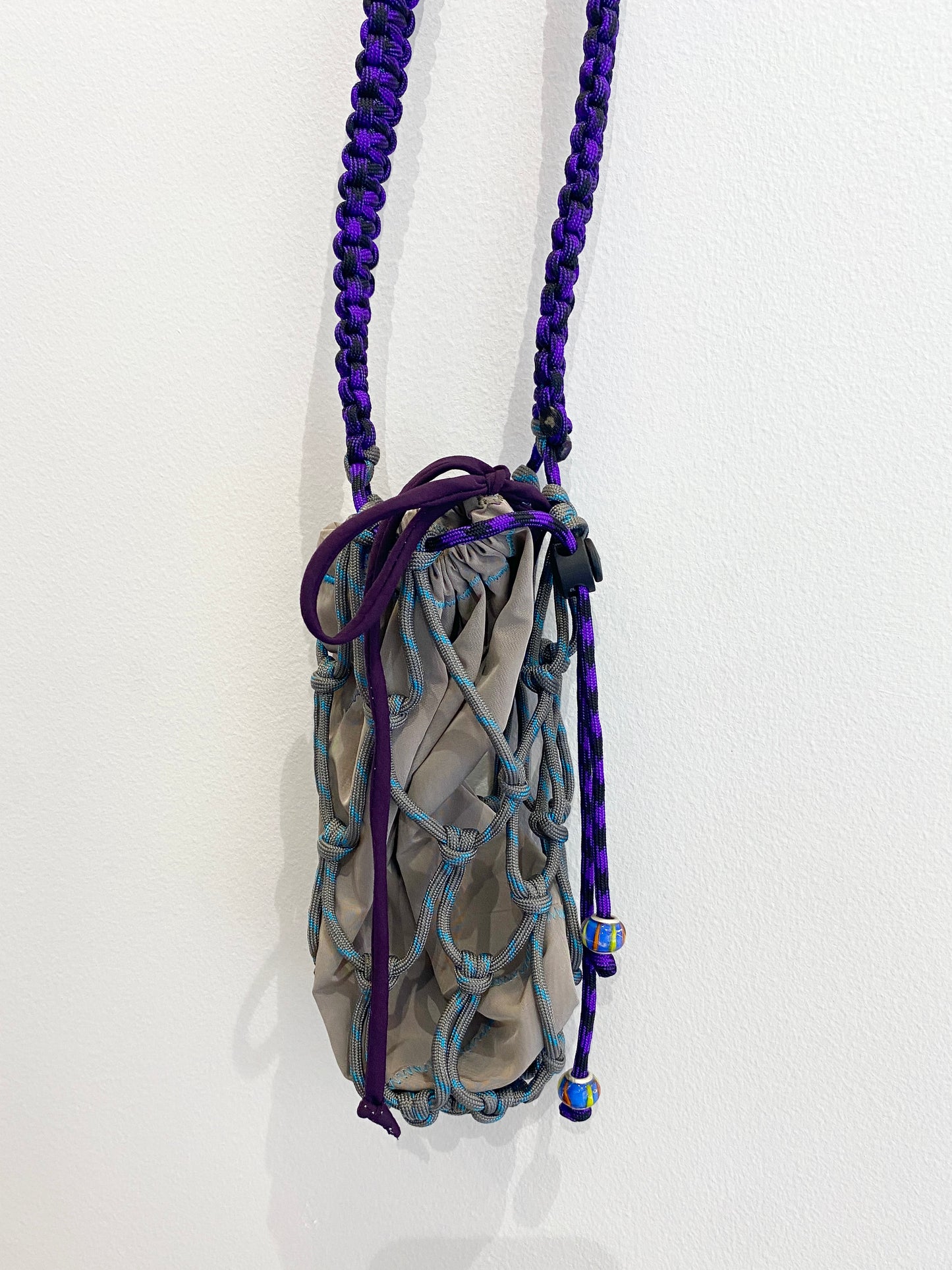 Amihan Aquilizan, over the shoulder bottle bag grey/turquoise/purple