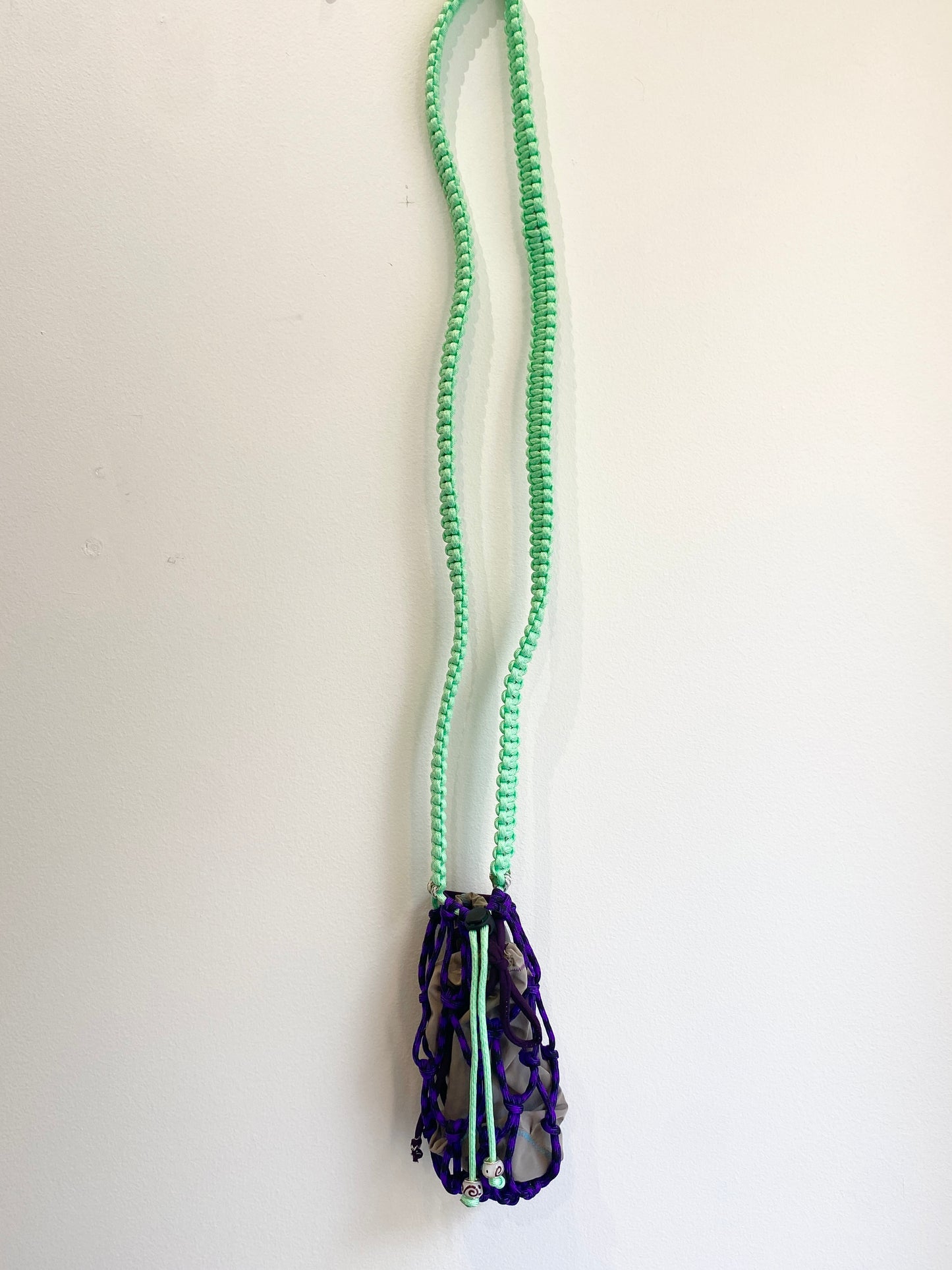 Amihan Aquilizan, cross body bottle bag purple/turquoise/black