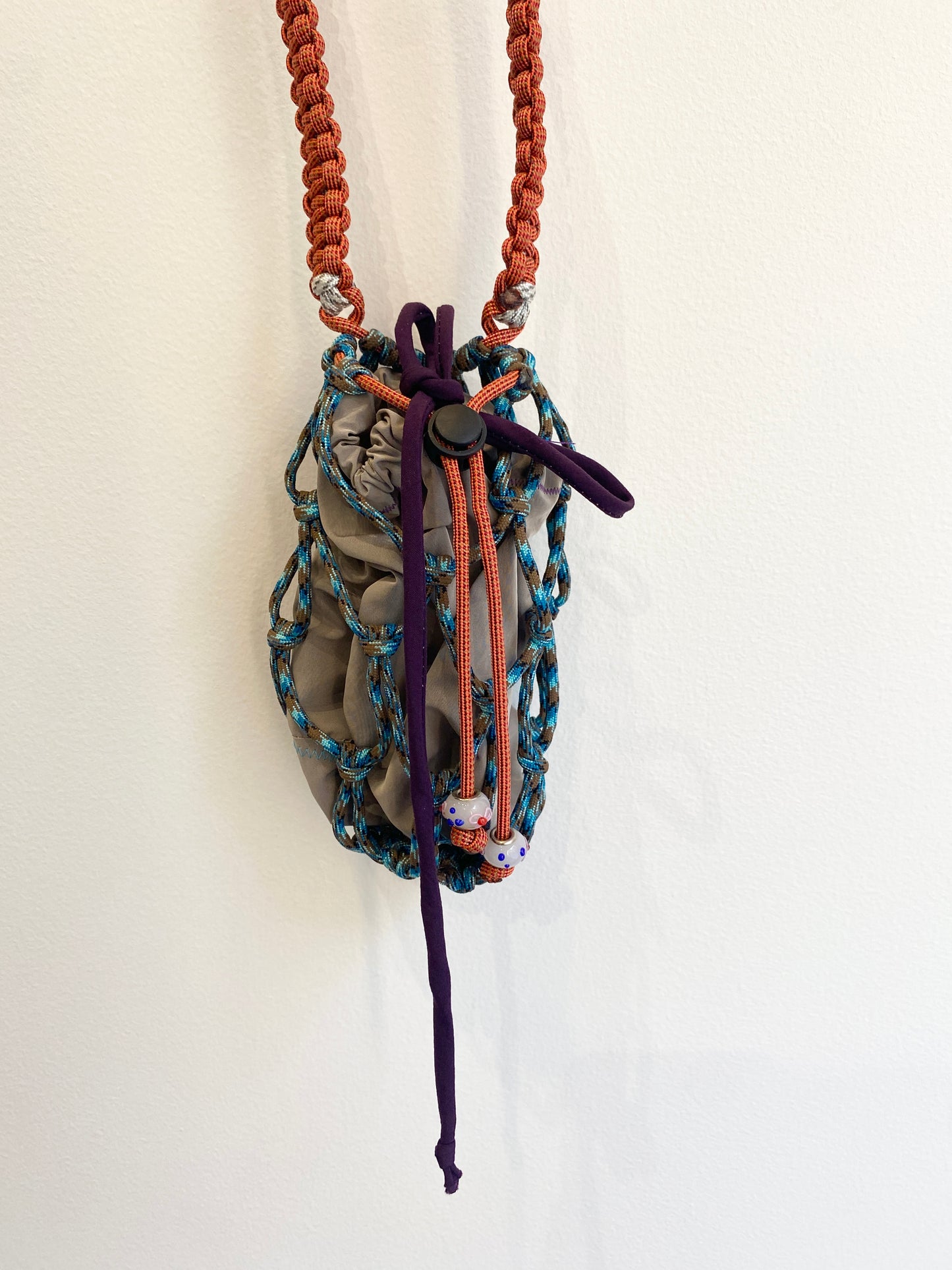 Amihan Aquilizan, cross body bottle bag orange/blue/grey