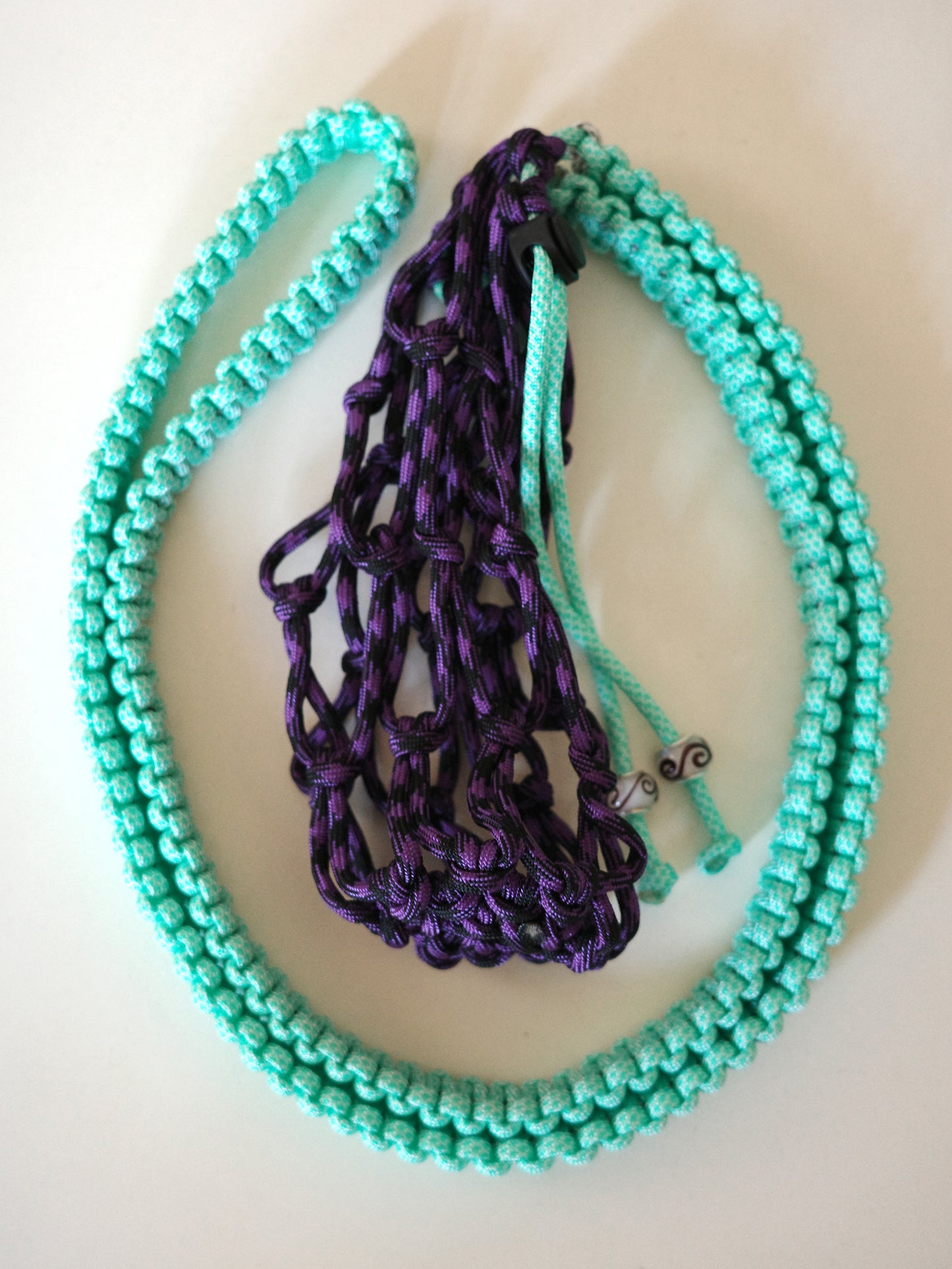 Amihan Aquilizan, cross body bottle bag purple/turquoise/black