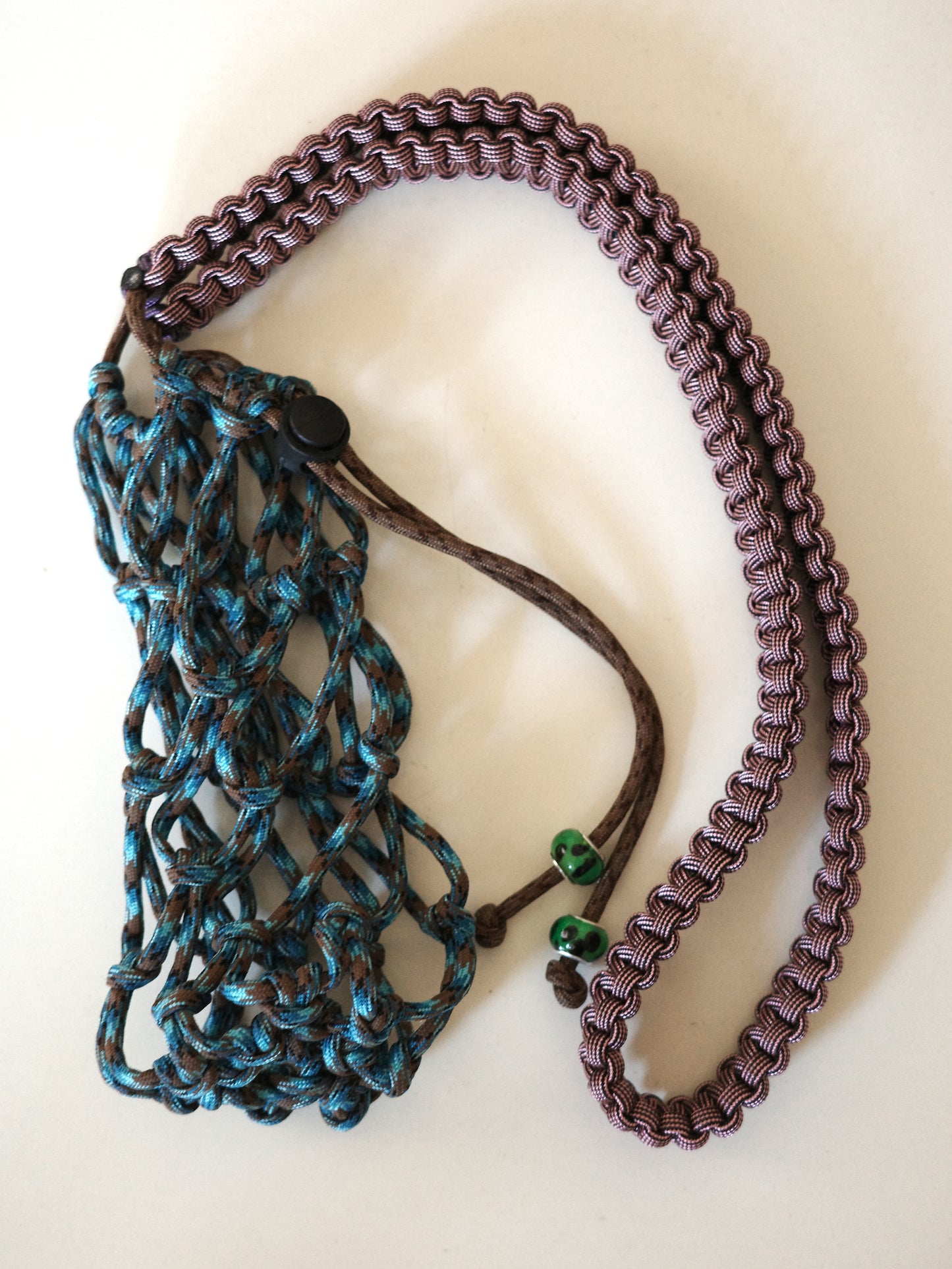 Amihan Aquilizan, over the shoulder bottle bag blue/brown/purple